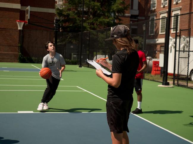 Young students playing basketball